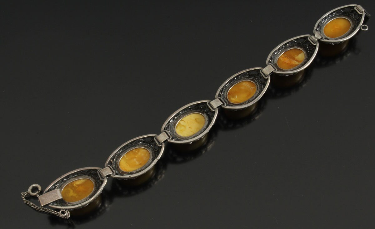 Amber pendant, a ring and a bracelet in silver 58 grams.