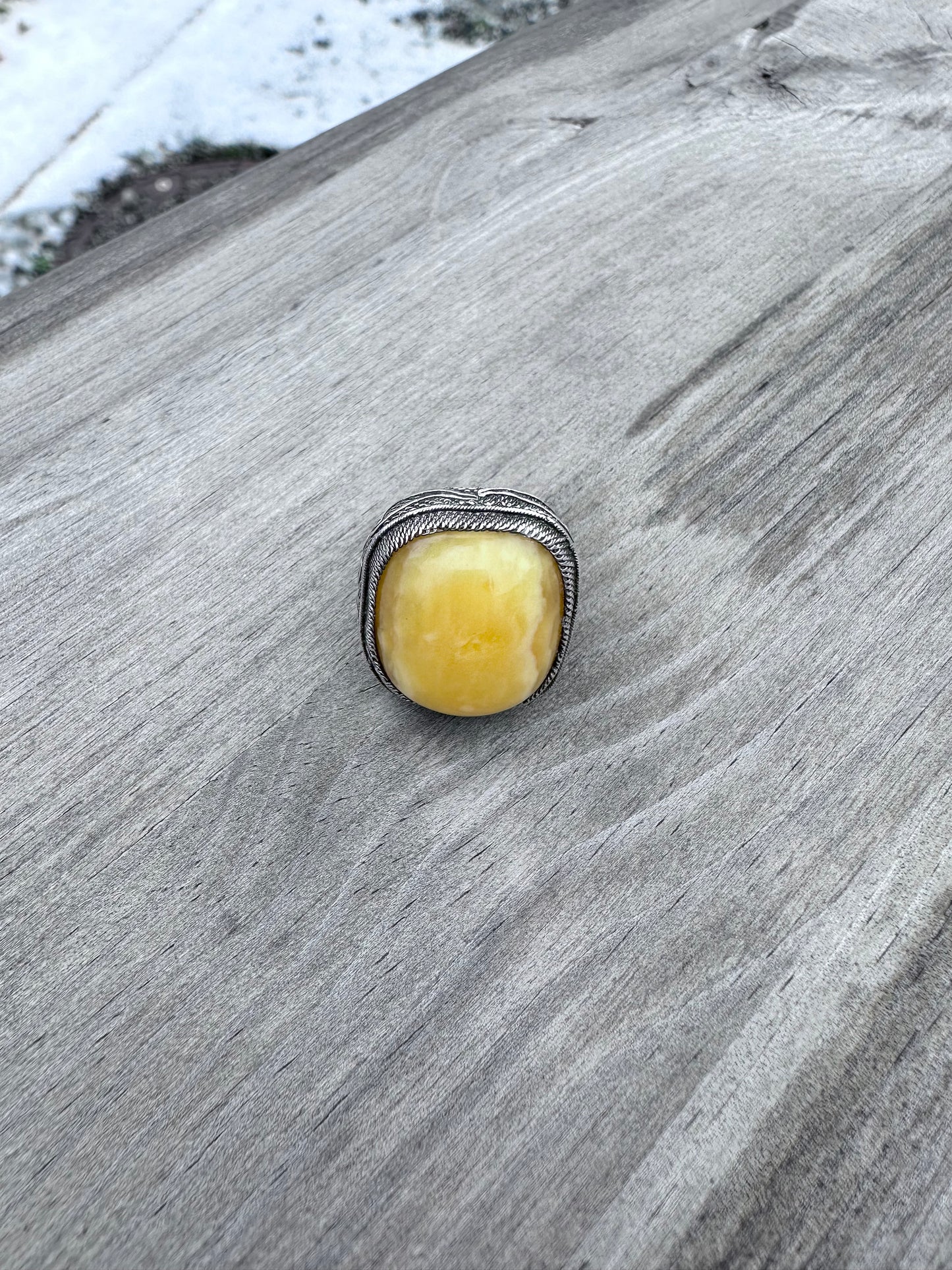 Natural amber in silver ring