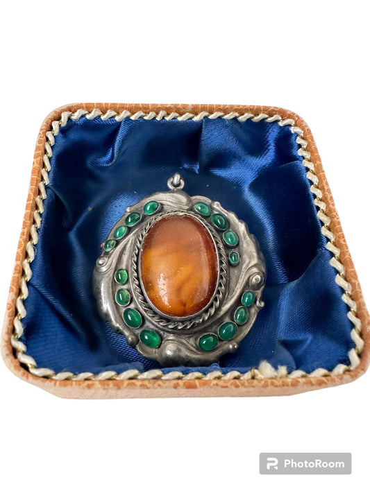 Art nouveau amber brooch with chalcedony.