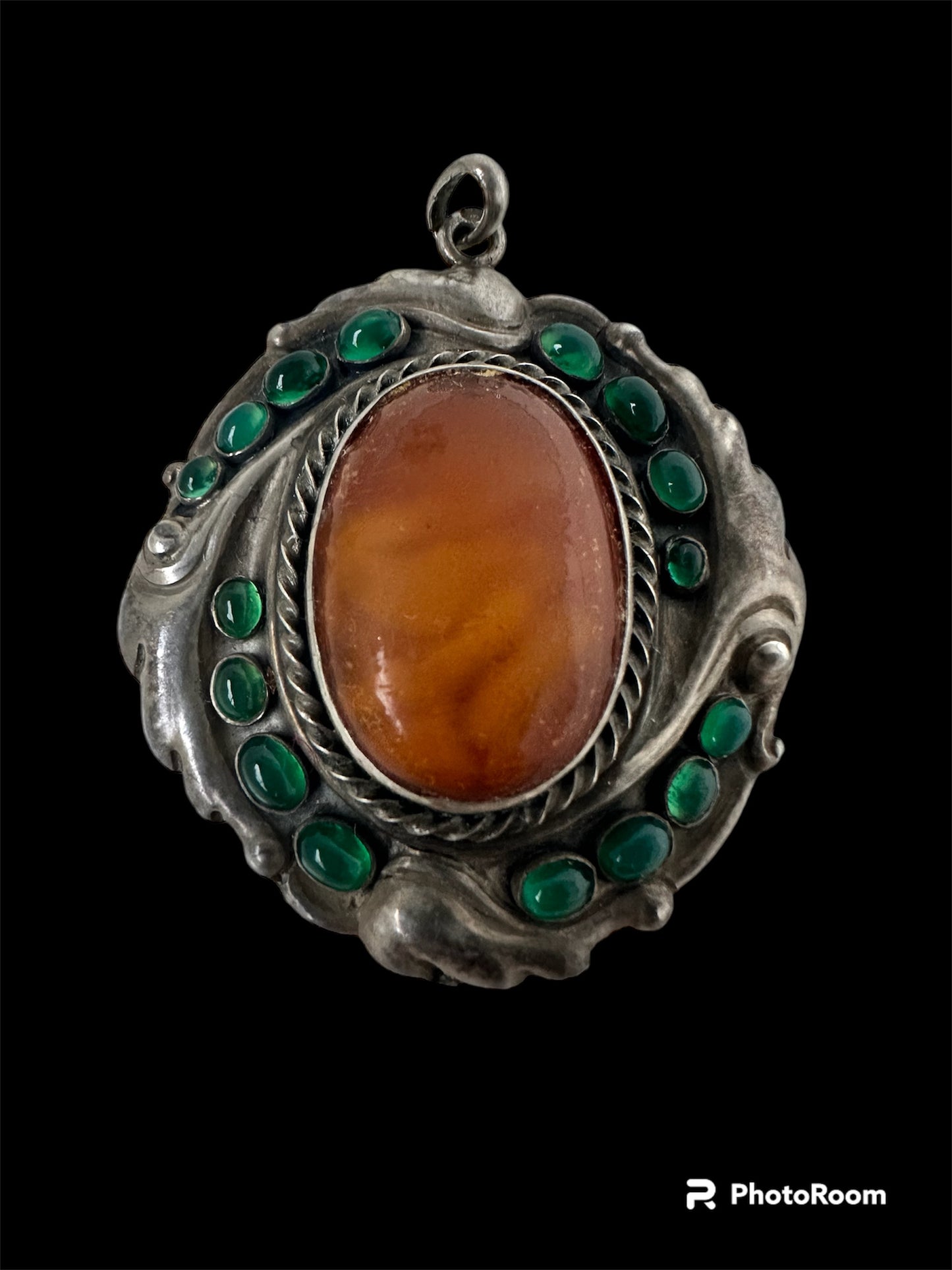 Art nouveau amber brooch with chalcedony.