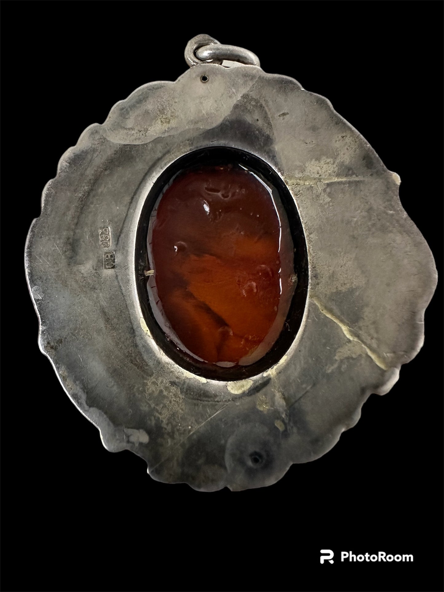 Art nouveau amber brooch with chalcedony.